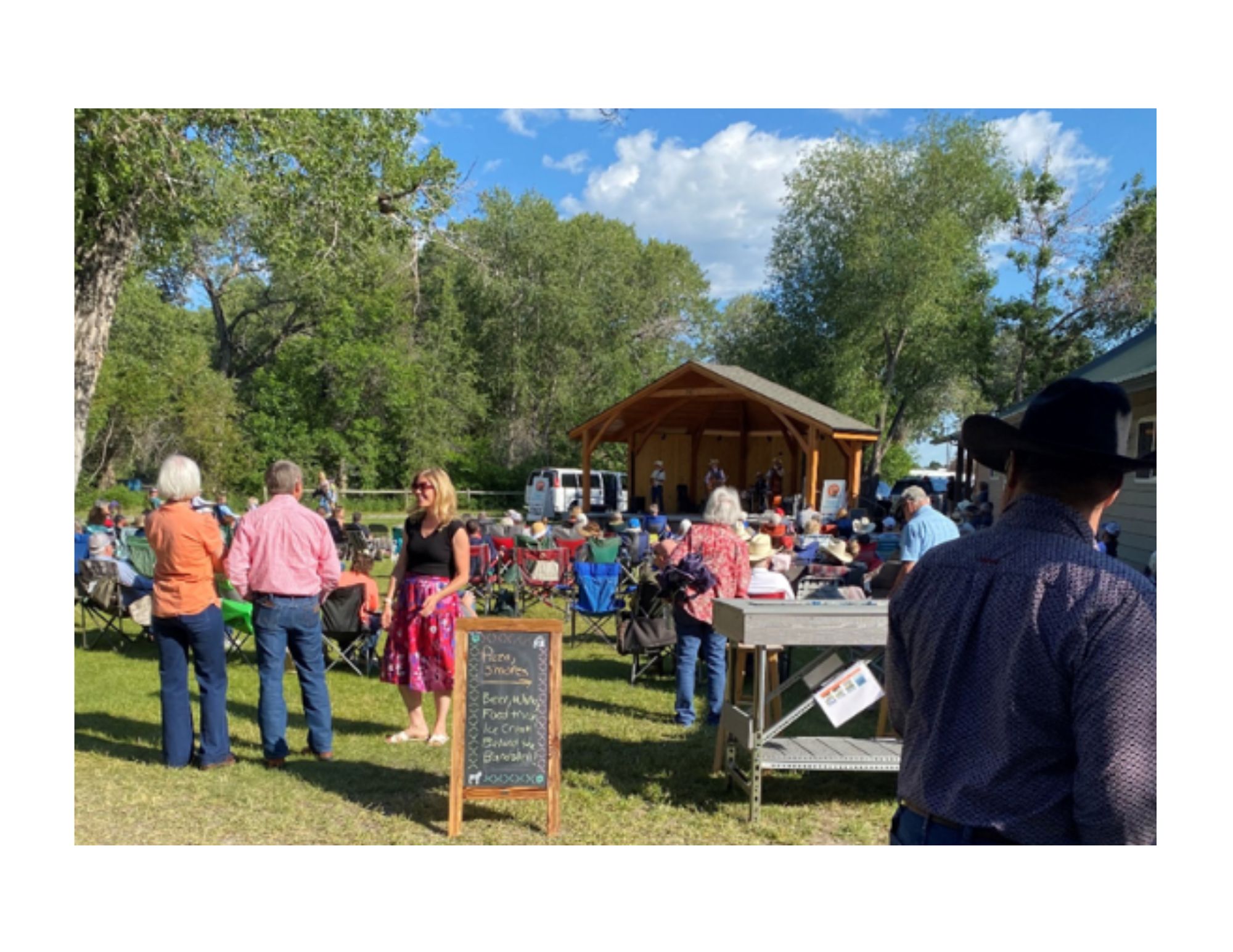 Locals grab their spots in the park as “Wiley and the Wild West” warms up. 